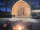 The log cabin with pretty lights whilst having a fire