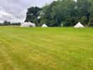 Communal tent with lots of bonus features. toilets clean and not smelly.