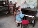 Playing piano in the games room