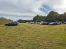 The campsite/carpark. toilet and shower can be seen at the far end of the field.