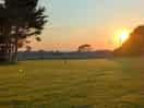 A campsite view of the sun setting