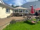 Reception/cafe outdoor seating near park