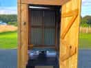 One of the two solar shower cabins