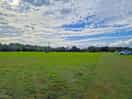 Large open field with plenty of spaces between pitches