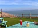 Seaside boarding house is just a short walk from the camp with fab food, cocktails and view!