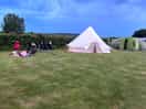 Green, flat grass beautiful to put your tent on.