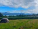 View of the sea and mountains from camping field