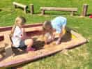 Sandpit in wooden play area