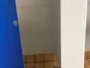 Small shower with grubby shower curtain