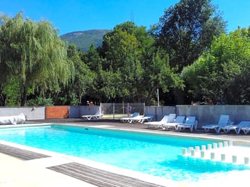 Pool with loungers and views