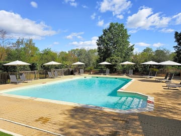 Pool with loungers and parasols