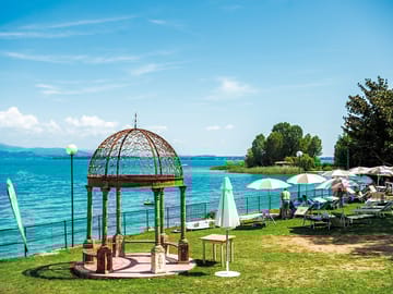 Lakeside sun terrace with free-to-use loungers and parasols