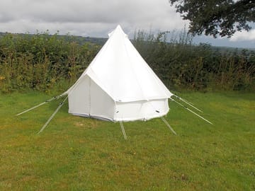 3m tent has single camp beds, bedside table, bedding, utensils, barbecue, charcoal and firewood
