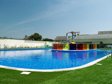 Swimming pool with sun loungers