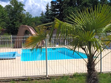 Swimming pool with paddling pool and slide