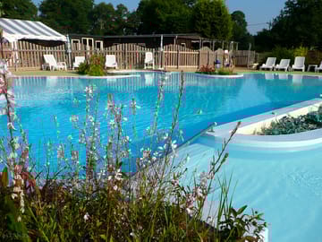 Swimming pool with bar behind