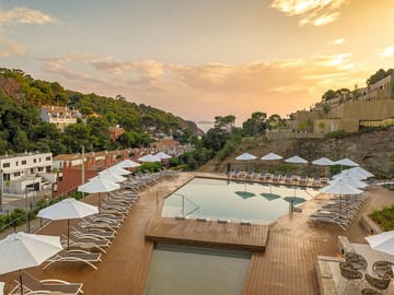 Outdoor pool and sun beds