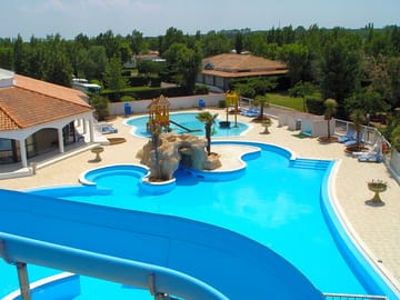 Outdoor pool with waterslide and paddling pool