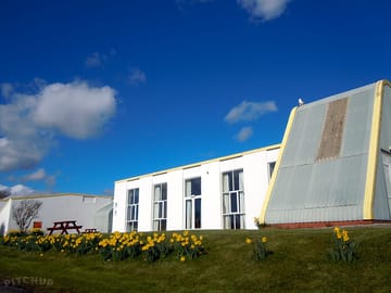 The front of yha manorbier main building in spring