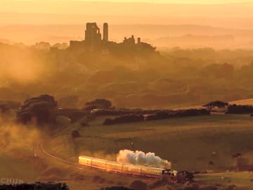 The steam train passes by in the distance. photo by a visitor.