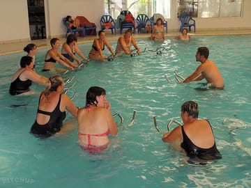 Exercise class using the pool's aqua bikes