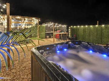 Hot tub lit up after dark