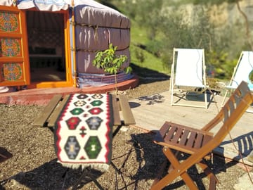 A small landscaped garden and terrace come with the yurt