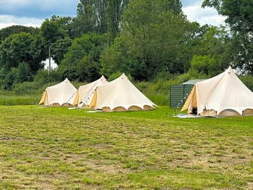 Bell tents on their pitches