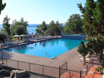Outdoor pool with loungers