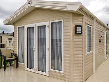 Double doors leading onto spacious decking area