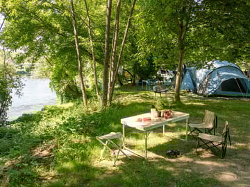 Some shaded pitches by the river