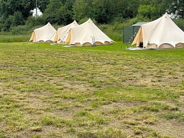 Bell tents on their pitches