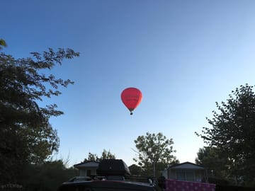 Balloon flying over in the morning