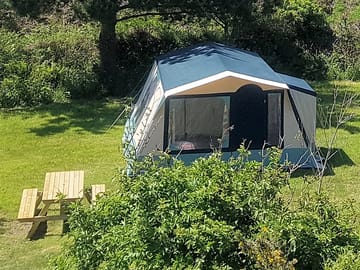 Tent with a picnic bench