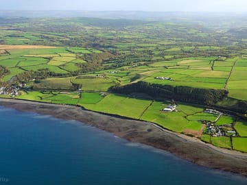 Aerial view of the coast around the site