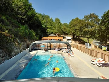 Heated pool with sliding roof