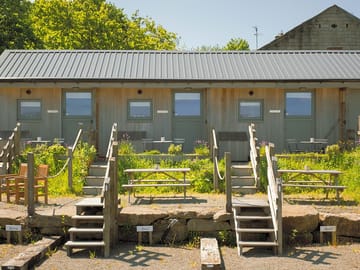 View of stable cabins lapwing, linnet and skylark