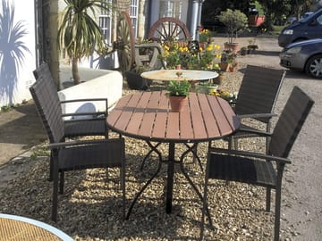 Coach and horses inn adjacent to camping field, serving food and drink