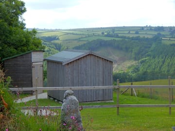 View of one of the huts with kitchen hut at side