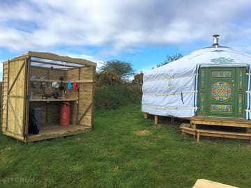 Hayfield yurt with outdoor kitchen