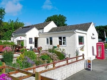 The main building and terrace restaurant at tyddyn isaf