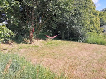 Cut grass pitch with hammock for your private use