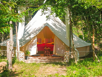 Tent entrance with afternoon sunshade curtains