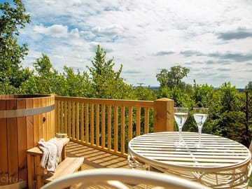 Kite's nest raised decking area with wood-fired hot tub