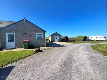 Site entrance and toilet block