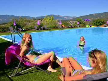 Relaxing by the swimming pool