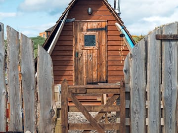 The main entrance with a fence and gate for privacy