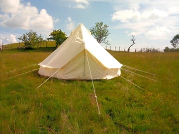 Outside of one of the bell tents
