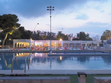 Swimming pool with restaurant behind