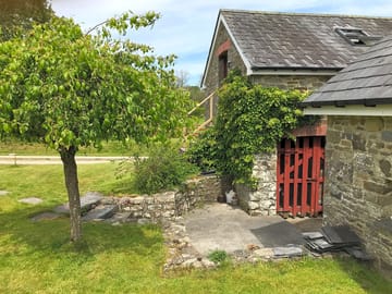 Hay loft steps and garden area, including area for cooking